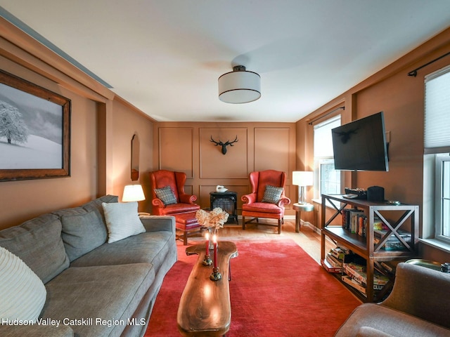 66 Maple Ave, Hunter, NY 12442 - living room featuring healthy amount of natural light and a decorative wall