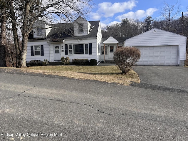 new england style home with a garage