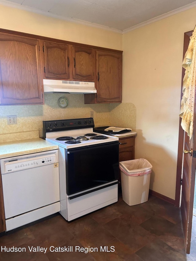 kitchen featuring decorative backsplash, white appliances, and ornamental molding