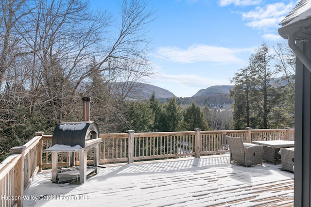 wooden terrace featuring a mountain view