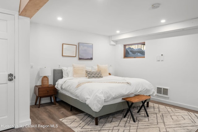 bedroom with wood-type flooring