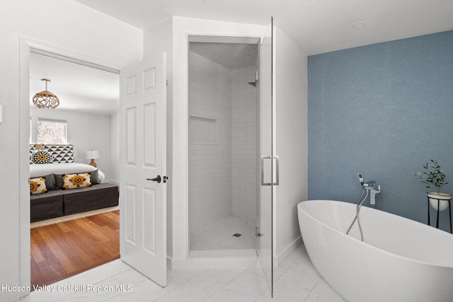 bathroom with separate shower and tub