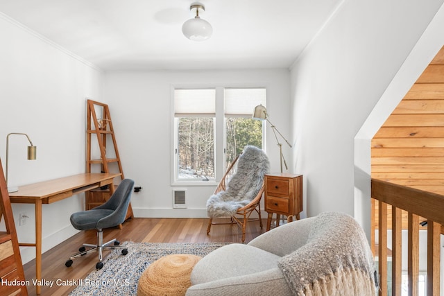 office featuring ornamental molding and hardwood / wood-style floors