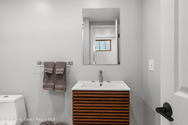 bathroom with vanity and toilet