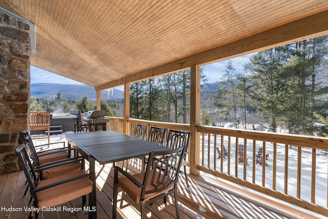 deck featuring a mountain view and a grill