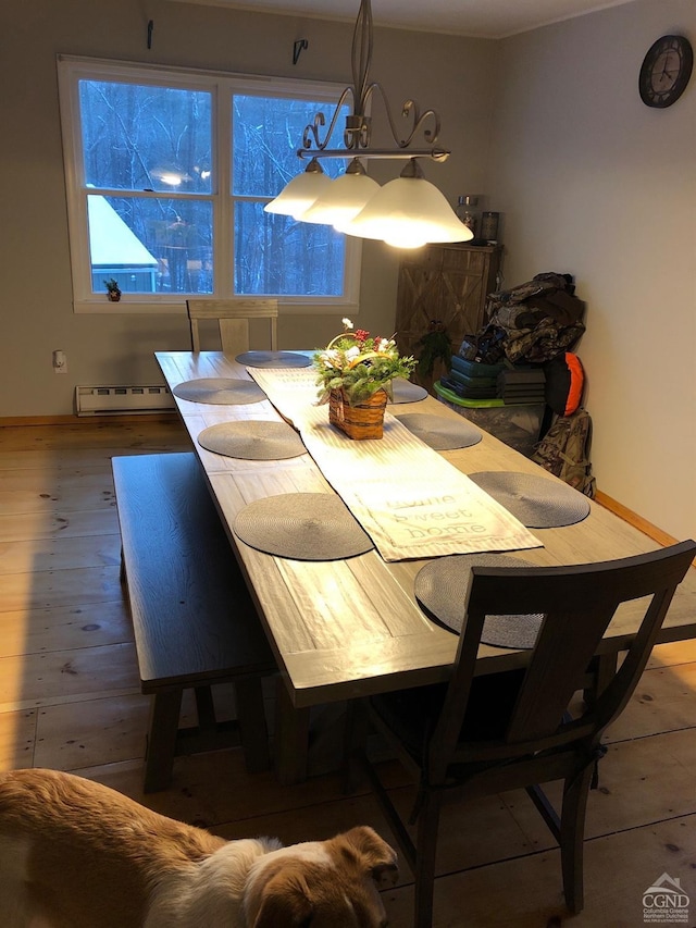 394 Peaceful Valley Rd, Canaan, NY 12029 - dining area with a baseboard radiator, wood finished floors, baseboards, and a chandelier