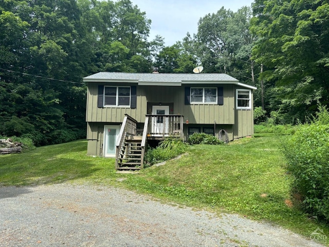 394 Peaceful Valley Rd, Canaan, NY 12029 - split foyer home featuring a front lawn and stairway