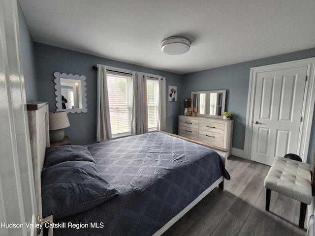 bedroom featuring wood finished floors