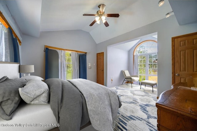 424 Joys Ln, Hurley, NY 12443 - bedroom featuring multiple windows, vaulted ceiling, and a ceiling fan