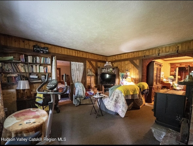 125 County Route 26a, Stuyvesant, NY 12106 - living room featuring wooden walls, carpet, and a textured ceiling