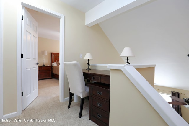 office with light colored carpet, baseboards, and beam ceiling