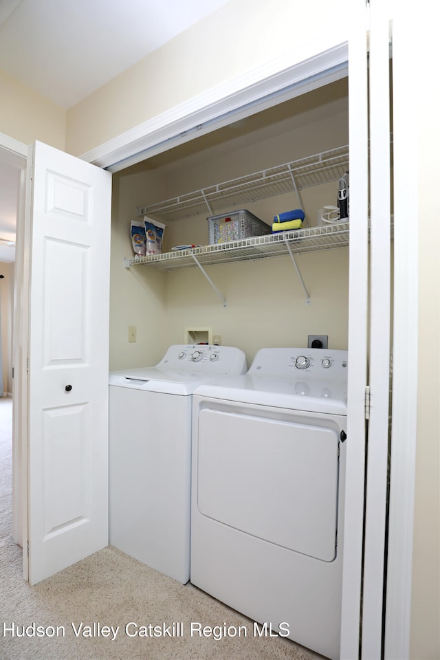 washroom featuring independent washer and dryer and laundry area