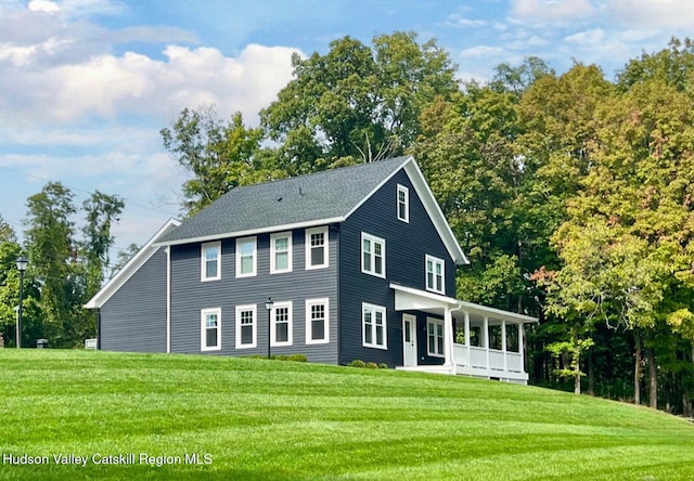 9 Chambers Rd, West Park, NY 12493 - view of front of home featuring covered porch, a front yard, and view of wooded area