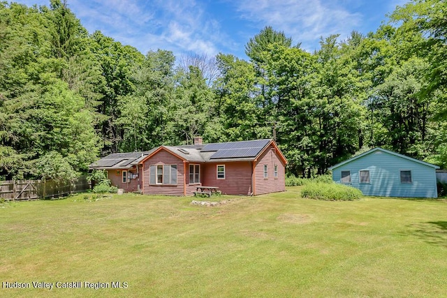 32 Harvey Mountain Rd, Austerlitz, NY 12017 - rear view of property with roof mounted solar panels and a chimney