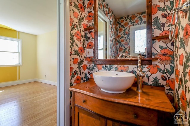 32 Harvey Mountain Rd, Austerlitz, NY 12017 - bathroom with baseboards, vanity, wallpapered walls, and wood finished floors
