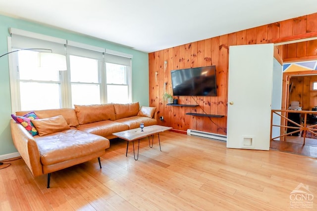 32 Harvey Mountain Rd, Austerlitz, NY 12017 - living room featuring baseboard heating, light wood-type flooring, and wooden walls