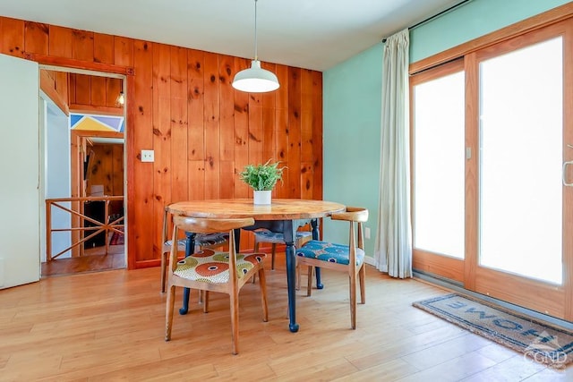 32 Harvey Mountain Rd, Austerlitz, NY 12017 - dining room with plenty of natural light, light wood-type flooring, and wooden walls