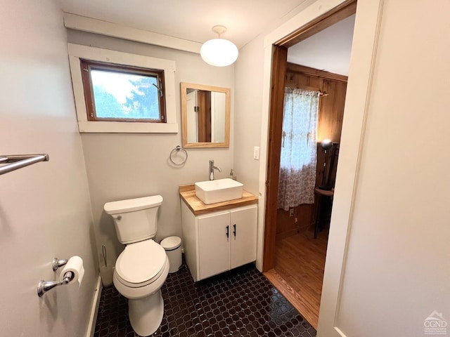 32 Harvey Mountain Rd, Austerlitz, NY 12017 - half bath featuring toilet, vanity, baseboards, and tile patterned flooring