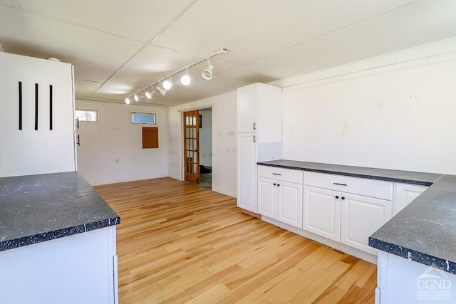 32 Harvey Mountain Rd, Austerlitz, NY 12017 - kitchen featuring track lighting, dark countertops, and light wood-type flooring