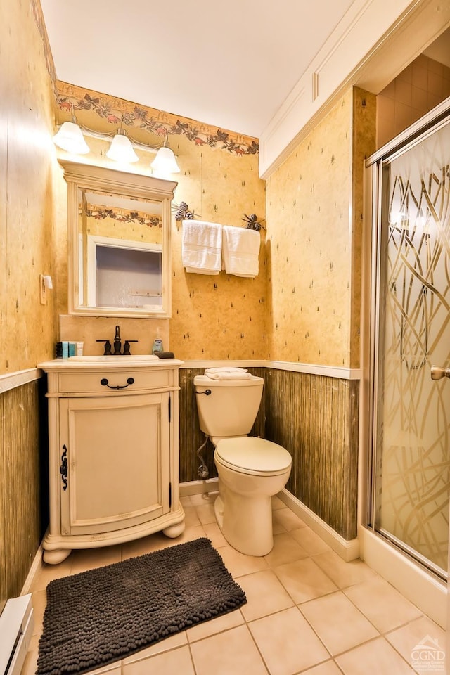 full bath with wallpapered walls, a wainscoted wall, toilet, a shower stall, and vanity