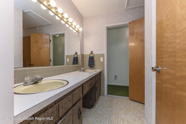 bathroom featuring tile patterned flooring and vanity