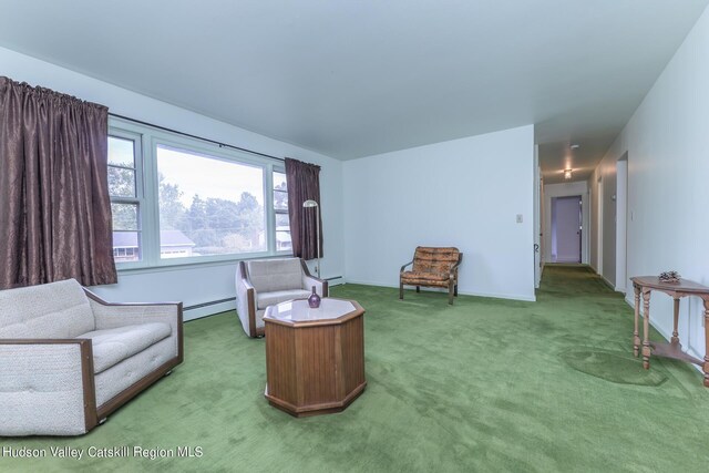 sitting room featuring carpet floors and baseboard heating