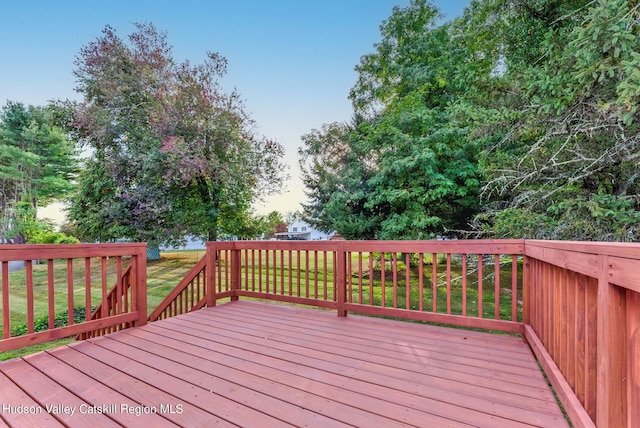 deck featuring a lawn