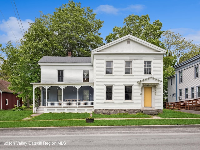 397 Main St, Franklin, NY 13775 - greek revival house with covered porch, a front yard, and a chimney