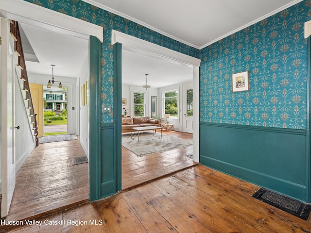 397 Main St, Franklin, NY 13775 - doorway featuring wallpapered walls, hardwood / wood-style floors, wainscoting, stairs, and ornamental molding
