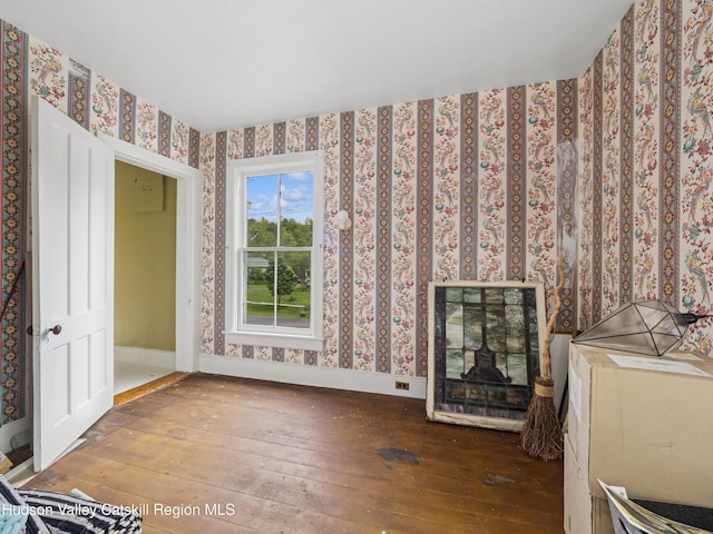 397 Main St, Franklin, NY 13775 - unfurnished living room with hardwood / wood-style floors, wallpapered walls, and baseboards