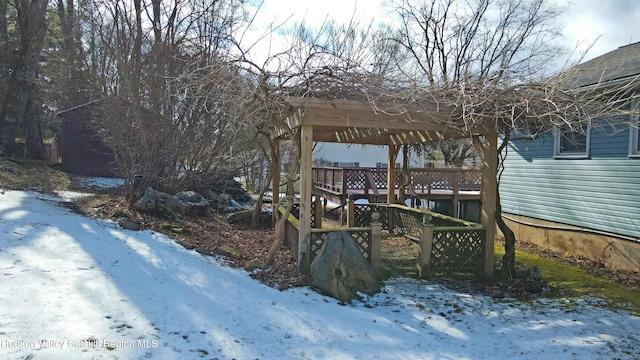 exterior space featuring a pergola and a deck