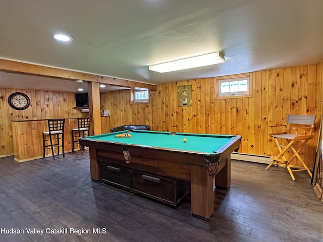 recreation room with pool table, bar, dark hardwood / wood-style floors, and wood walls