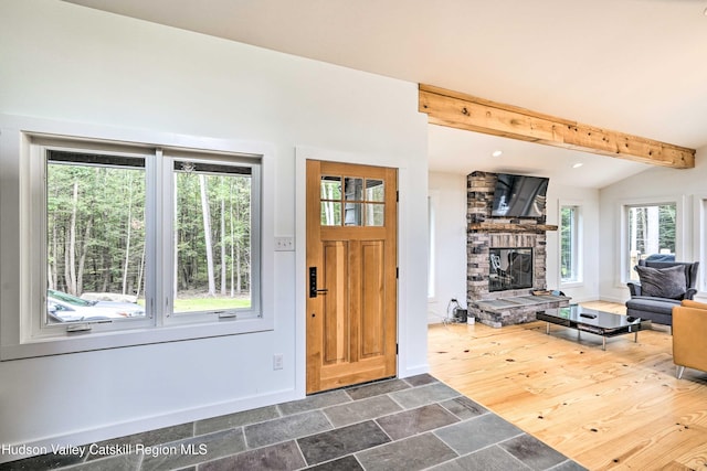 158 Rivka Rd, Saugerties, NY 12477 - entrance foyer featuring stone finish flooring, a stone fireplace, baseboards, beamed ceiling, and recessed lighting