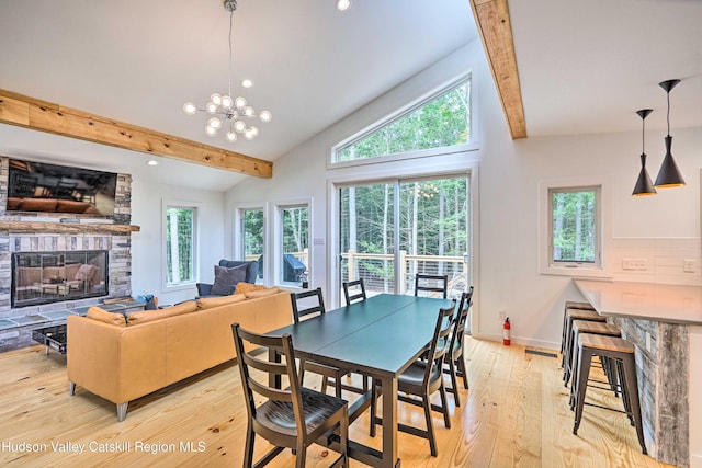 158 Rivka Rd, Saugerties, NY 12477 - dining space with lofted ceiling, a stone fireplace, baseboards, recessed lighting, and light wood-type flooring