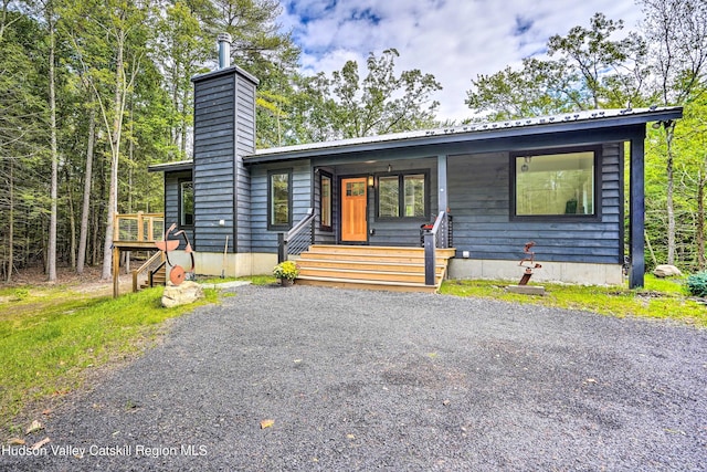 158 Rivka Rd, Saugerties, NY 12477 - chalet / cabin featuring a porch, a chimney, and metal roof
