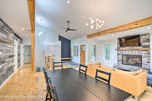 158 Rivka Rd, Saugerties, NY 12477 - dining area featuring a fireplace, light wood-style floors, high vaulted ceiling, recessed lighting, and ceiling fan with notable chandelier