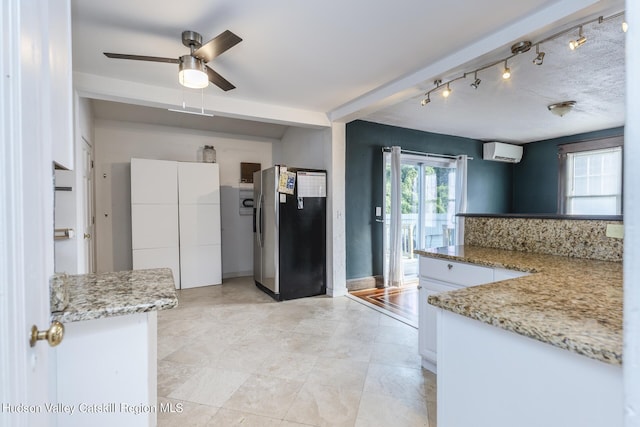 kitchen with white cabinets, stainless steel fridge with ice dispenser, and plenty of natural light