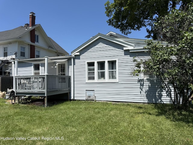 29 Railroad Ave, Chatham, NY 12037 - rear view of house featuring a deck and a yard