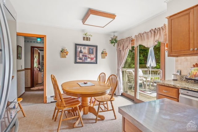 dining room featuring baseboard heating and ornamental molding