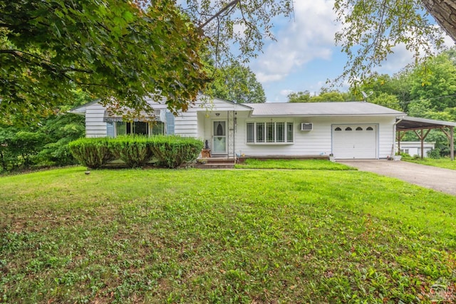 view of front of house with an attached garage, a front yard, driveway, and a wall mounted air conditioner