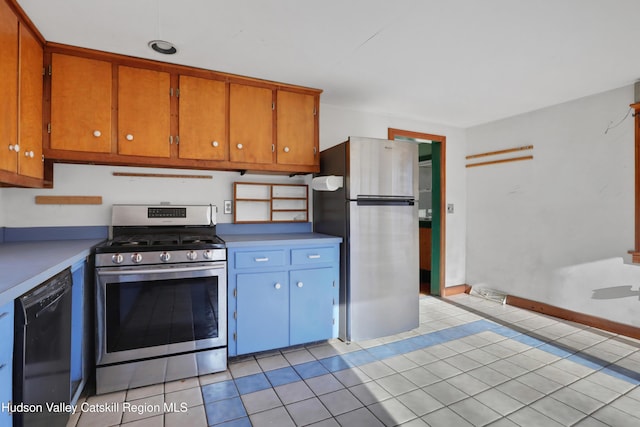 kitchen with light tile patterned floors and stainless steel appliances