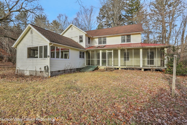 rear view of property with a sunroom