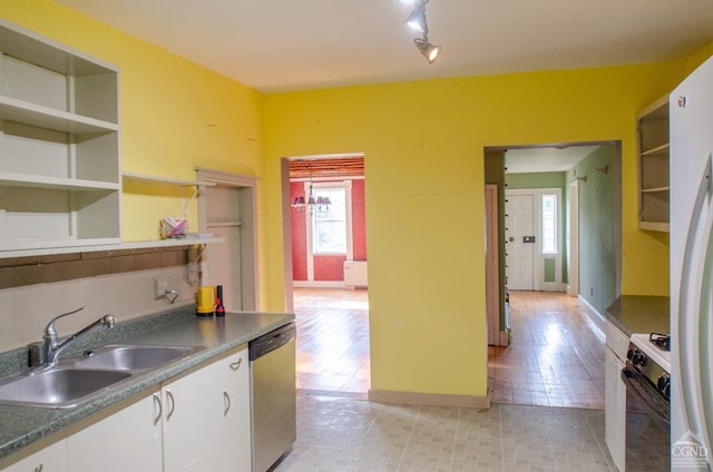 kitchen with a sink, stainless steel dishwasher, gas range, and healthy amount of natural light