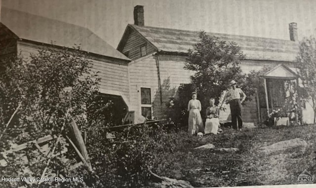 view of side of property featuring a chimney