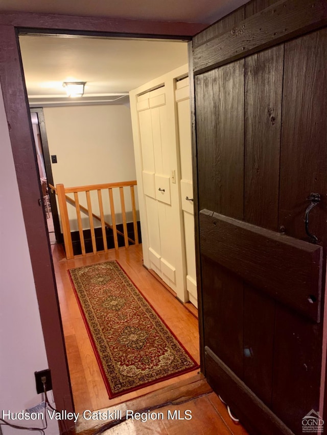 hallway with wood finished floors
