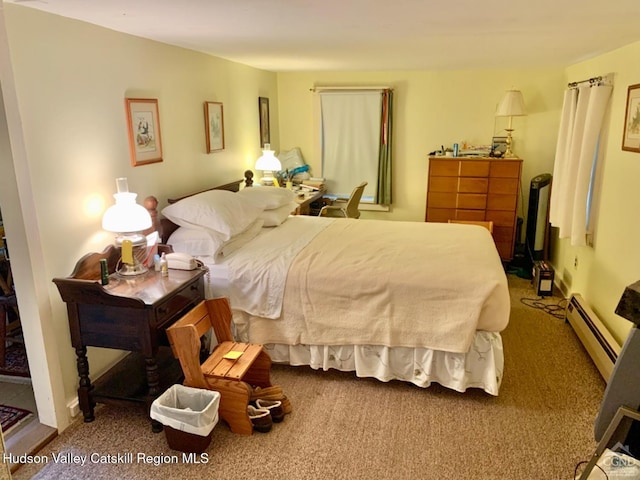 bedroom with a baseboard radiator and carpet