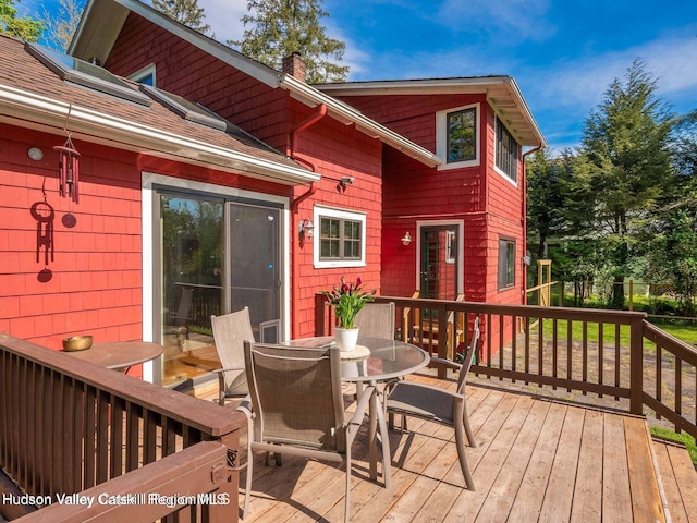 12 Library Ln, Woodstock, NY 12498 - wooden deck featuring outdoor dining area