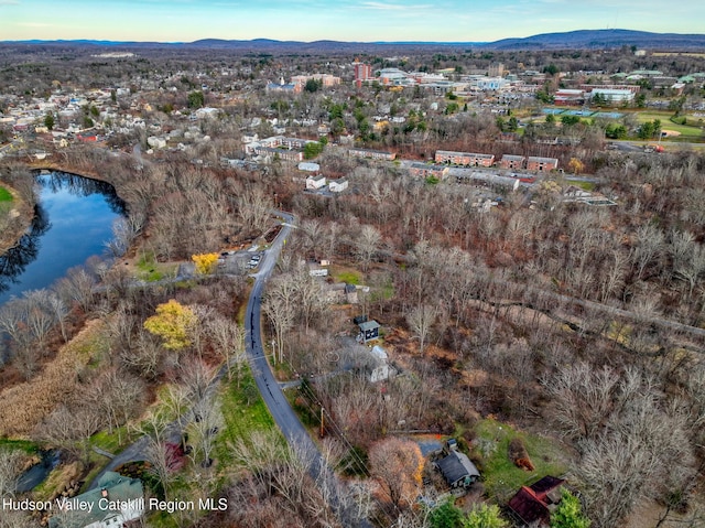 aerial view featuring a water and mountain view