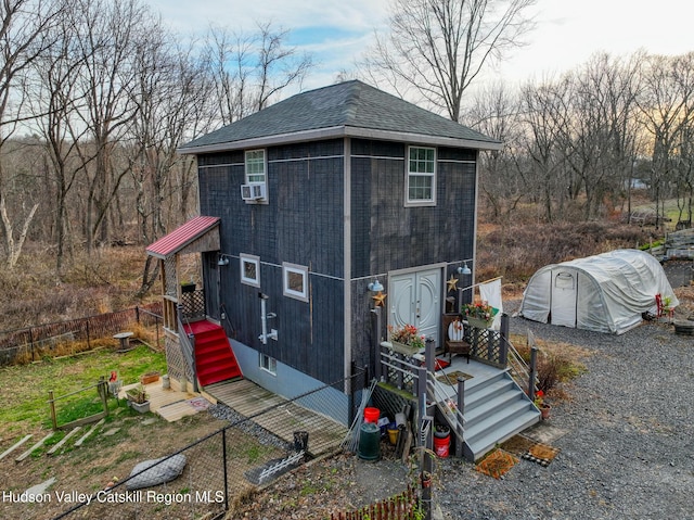 back of property with cooling unit