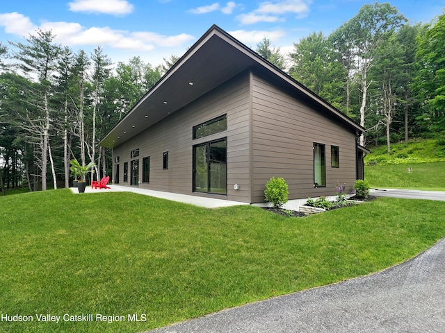501 Birch St, Copake, NY 12516 - view of property exterior with a patio area and a lawn
